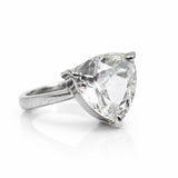 Silver ring with a large pear-shaped diamond on a white background