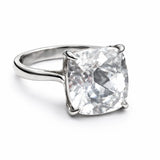 Silver ring with a large diamond on a white background