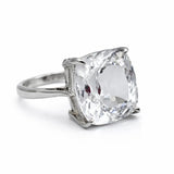 Silver ring with a large clear gemstone on a white background