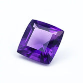 Square-cut purple gemstone on a white background