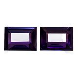 Two purple gemstones with a rectangular cut on a white background