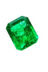 Faceted green gemstone on a white background