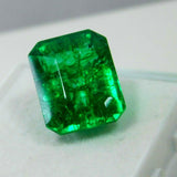 Natural Colombian Emerald Cut Gemstone weighing 10.20 Ct placed center-aligned on white surface