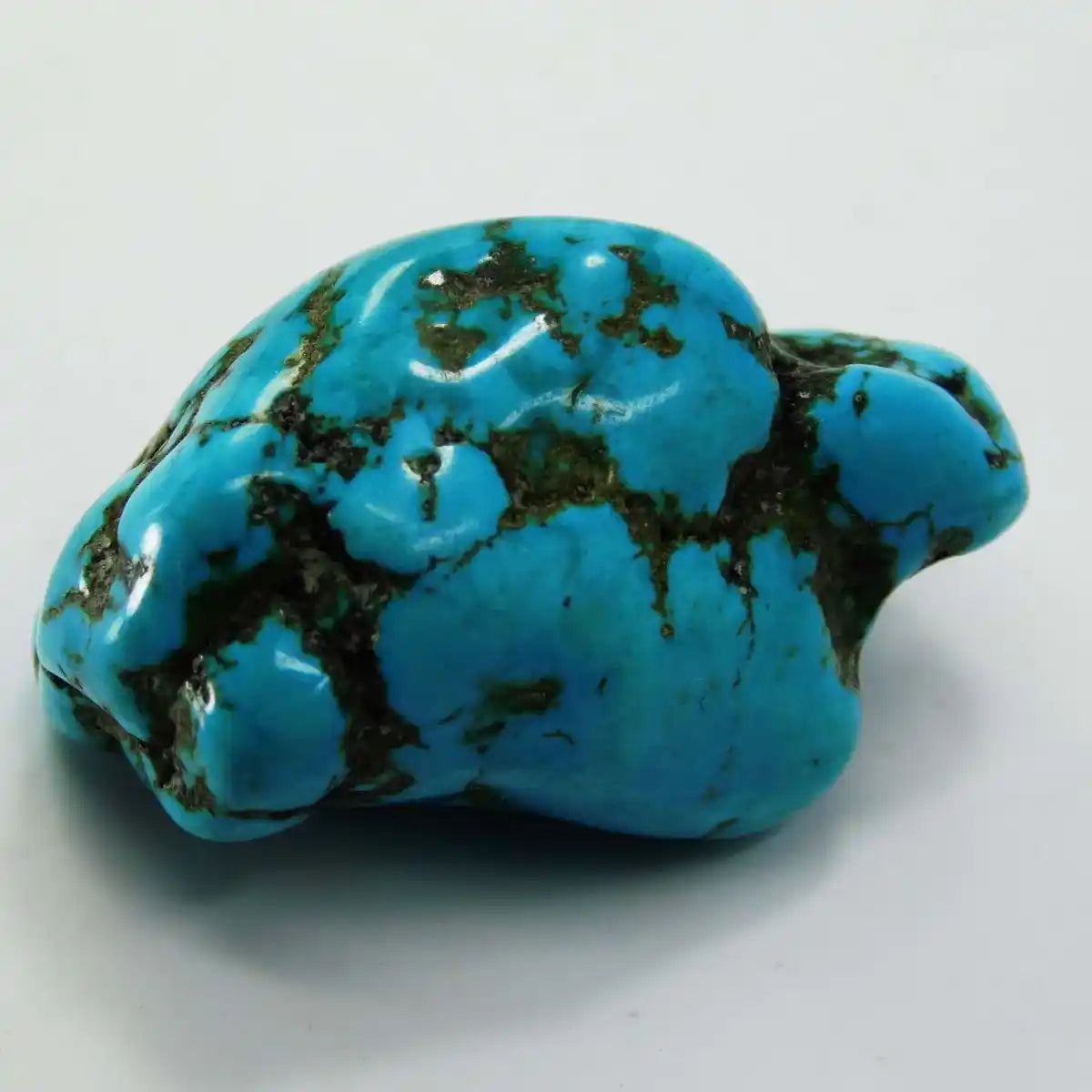 Turquoise stone on a white background