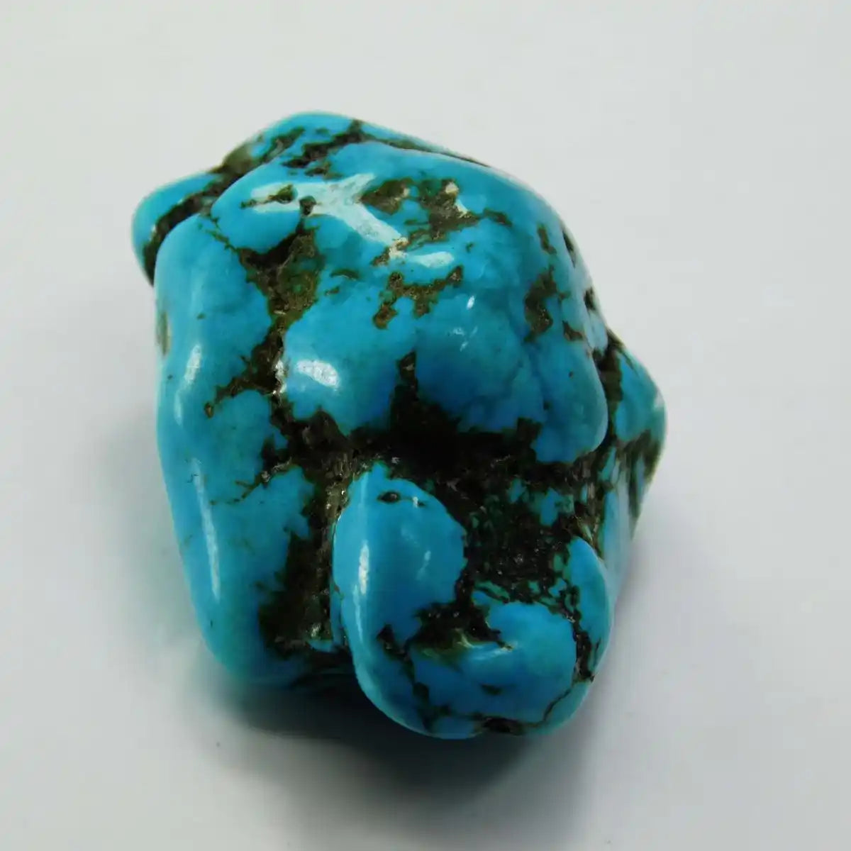 Turquoise stone on a white background