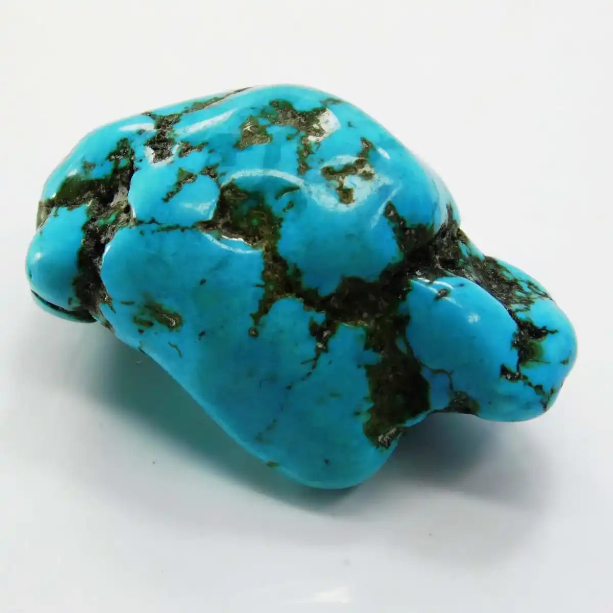 Turquoise stone with green veins on a white background