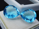 Certified Aquamarine Pear Cut Gemstone Pair Displayed on White Box - Excellent Cut and Polish

