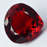 Natural 10.60 Ct Ruby Pear Cut Gemstone Displayed on White Background Eye Clean and Certified
