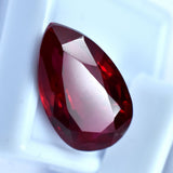 17.25 Ct Pear Cut Red Ruby Gemstone Placed on White Background Natural and Certified