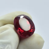 . Natural Pigeon Blood Ruby 7.55 Ct Oval Cut Held in Gloved Fingers - Translucent Pink Gemstone