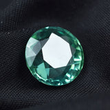 Certified natural Montana sapphire, 12.55 ct round cut.