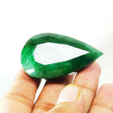 Loose emerald gemstone turned toward the right side