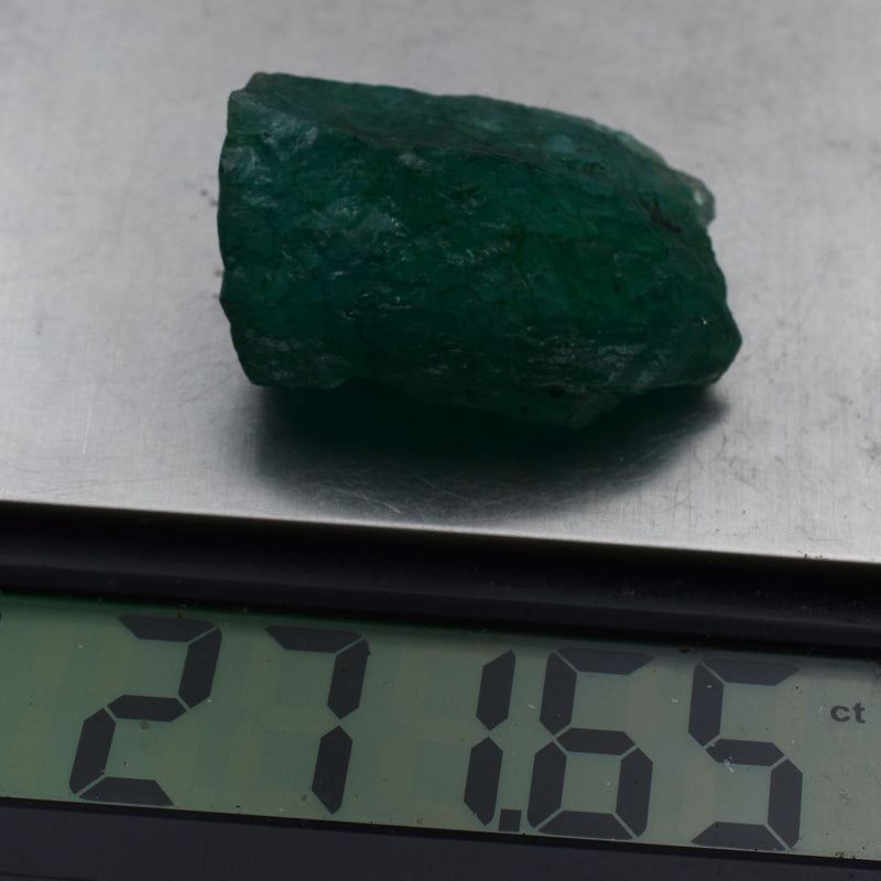 Natural Emerald Rough 272.05 Ct - close-up of certified green gemstone