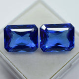 Certified loose gemstone pair, natural blue Ceylon sapphires, emerald cut, total 14.95 carats.