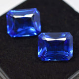 High-quality certified blue Ceylon sapphire pair, natural emerald cut, total weight 14.95 carats.