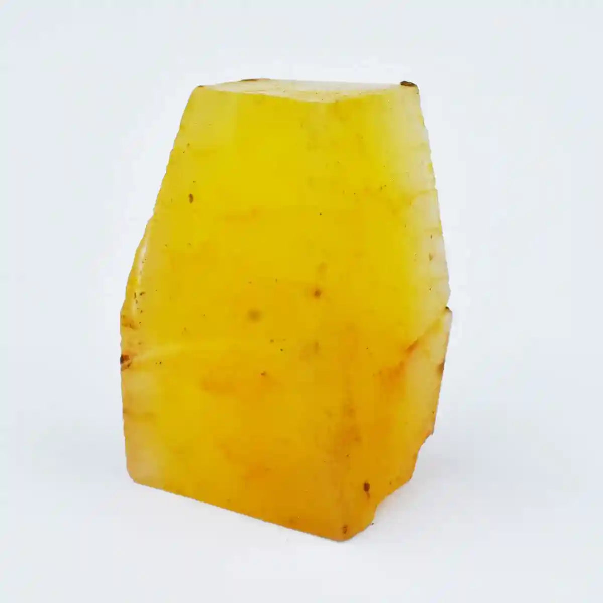 Block of yellow cheese on a white background