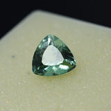 Certified 3.60 ct natural bluish-green grandidierite trillion cut gemstone.