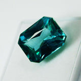 12.56 carat bluish-green emerald cut grandidierite, certified natural gemstone.
