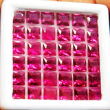 Top view of red square cut rubies in white box – 5 mm natural gemstones, Burma origin