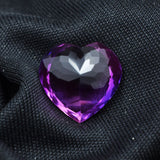 9.10 Carat Translucent Purple Tanzanite Loose Gemstone – Heart Shape on Black Surface
