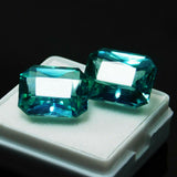 Loose gemstone pair of certified emerald cut natural grandidierites, green, total 20.10 ct.