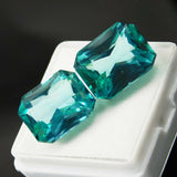 Loose gemstone pair of certified emerald cut natural grandidierites, green, total 20.10 ct.