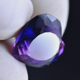 Certified 8.35 Ct Purple Tanzanite Heart Cut Gemstone Held on Finger – Natural Clarity Enhanced


