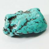 Turquoise stone with black veins on a white background