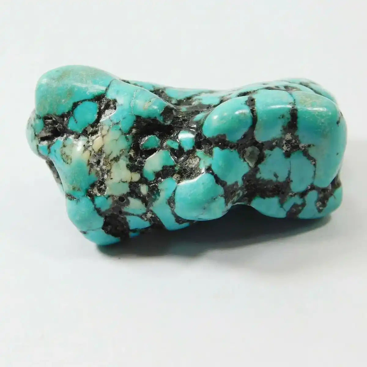 Turquoise stone on a white background