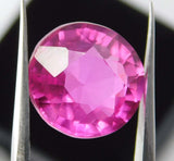 Natural pink ruby round cut held in jewel tool – 8.30 Ct certified and clarity enhanced gemstone