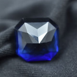 Tanzanite 15.60 Carat Square Shape Gemstone Displayed on Black Background