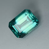 High-quality certified 11.80 carat natural grandidierite, bluish-green emerald cut gemstone.