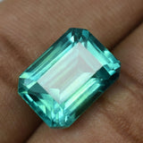 High-quality certified 11.80 carat natural grandidierite, bluish-green emerald cut gemstone.