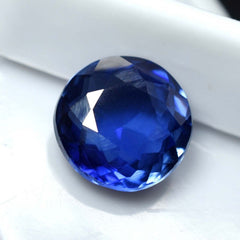 Natural Round Blue Tanzanite Gemstone with Excellent Cut Displayed on White Background