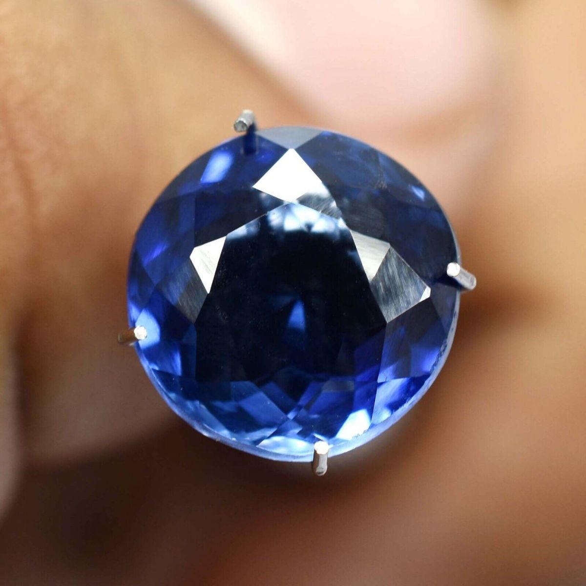 Natural Tanzanite Blue Round Gemstone in Hand - Certified, Vintage, and Wholesale