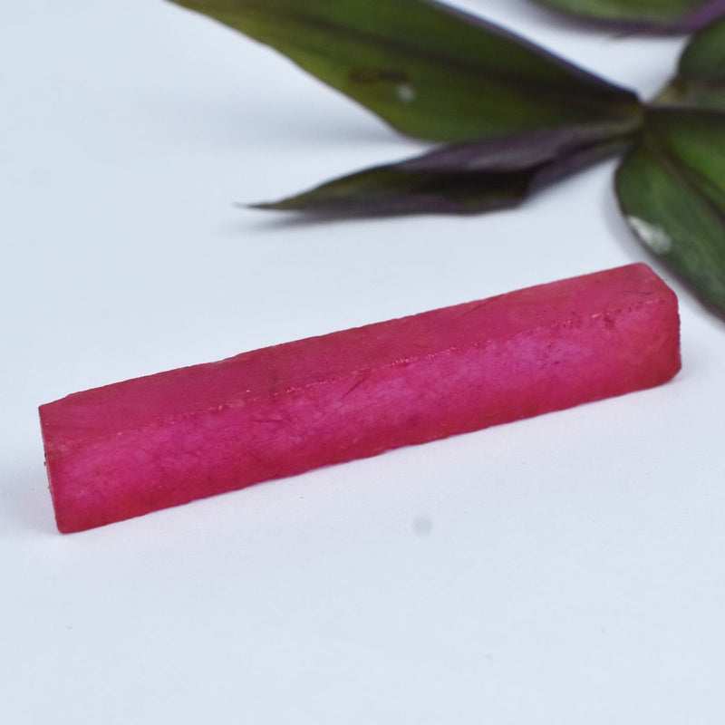 Red Ruby Rough in-hand for scale 72.80 carat rough ruby