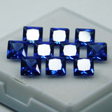 76 natural, square-cut blue sapphire gemstones, each 5x5 mm in size.