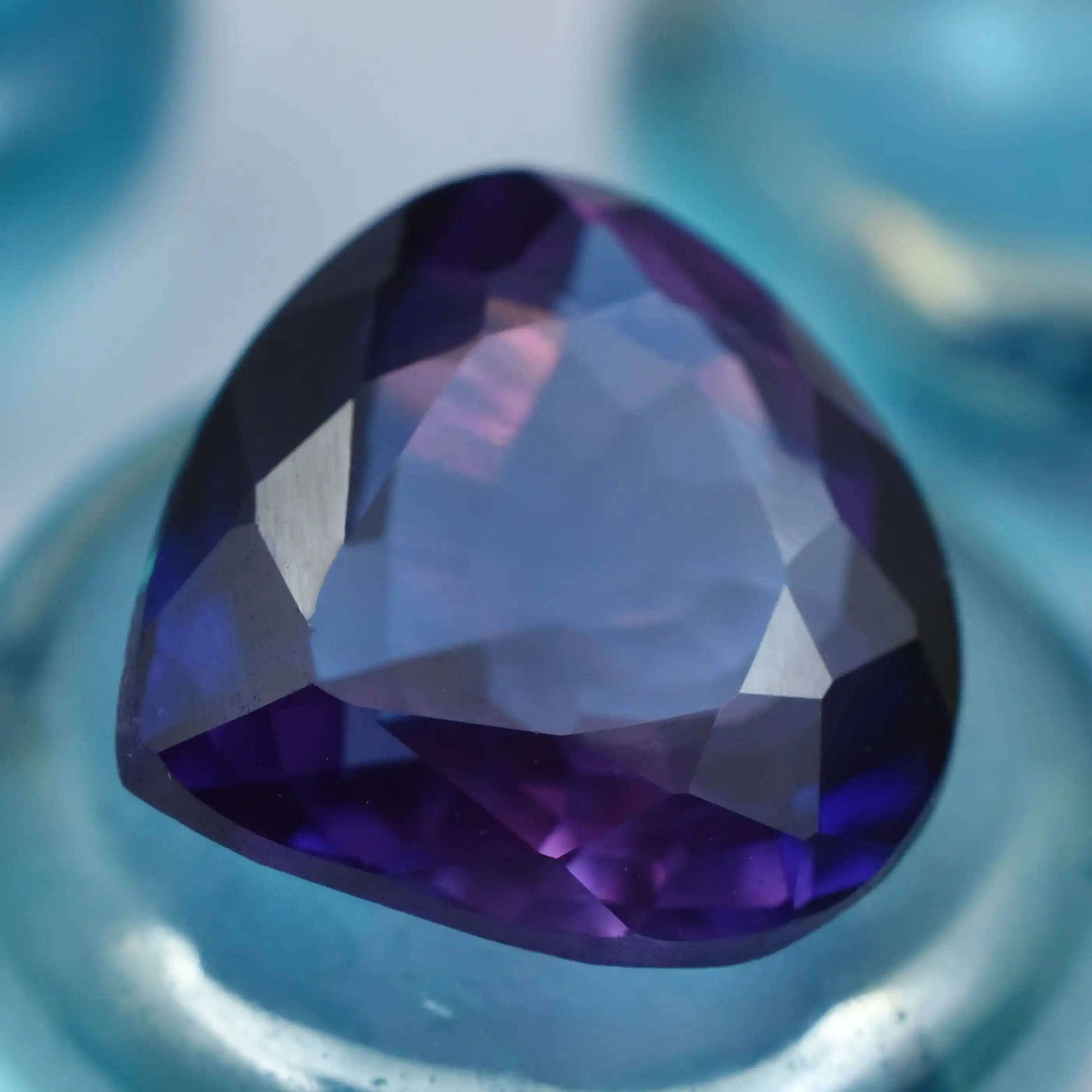 Premium purple amethyst stone in trillion shape with sharp edges and radiant shine.