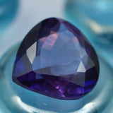 Premium purple amethyst stone in trillion shape with sharp edges and radiant shine.
