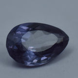 7.25 Carat Pear Cut Color-Change Alexandrite placed on white background highlighting clarity and cut