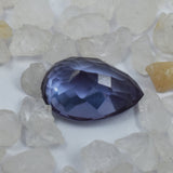 Color-change Alexandrite placed in between white rough stones for natural aesthetic presentation