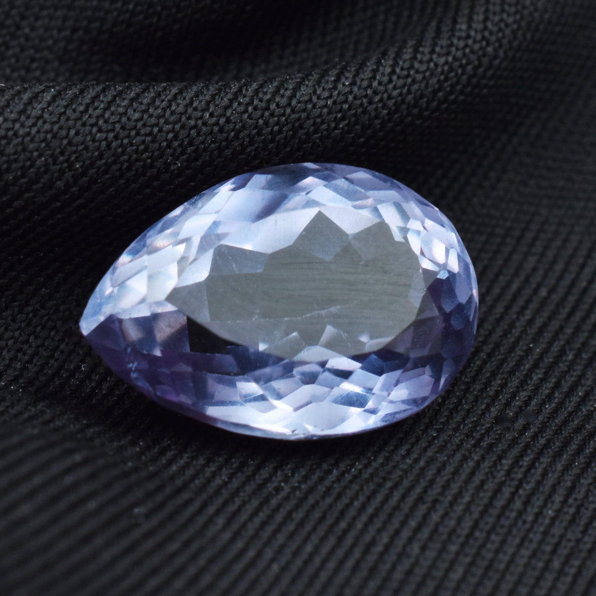 Certified 10.65 Ct Alexandrite displayed on black background emphasizing brilliance and depth