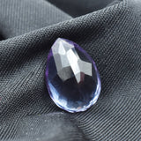 Vertical view of 10.65 Ct Alexandrite on black background highlighting symmetrical pear shape