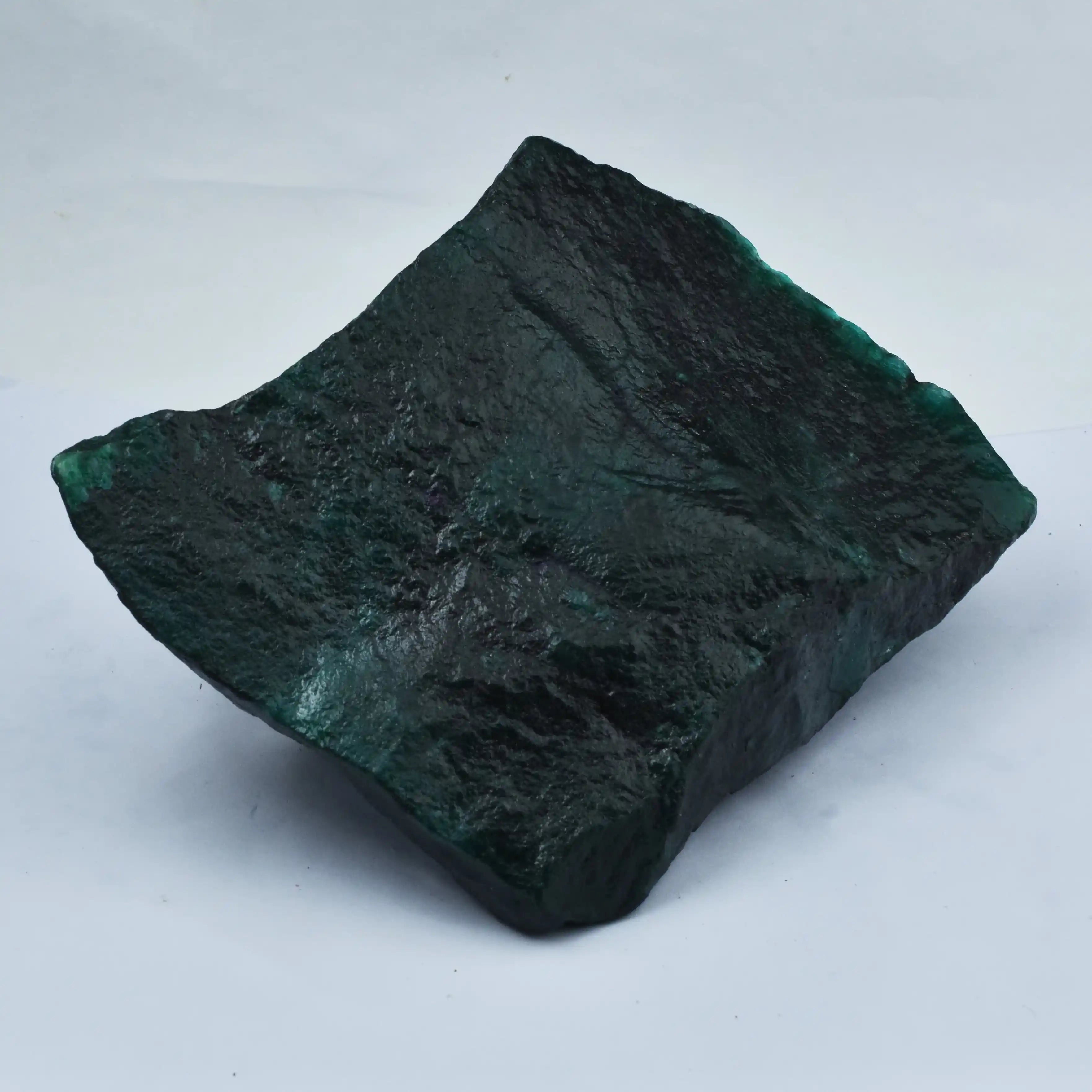 Dark green stone on a white background