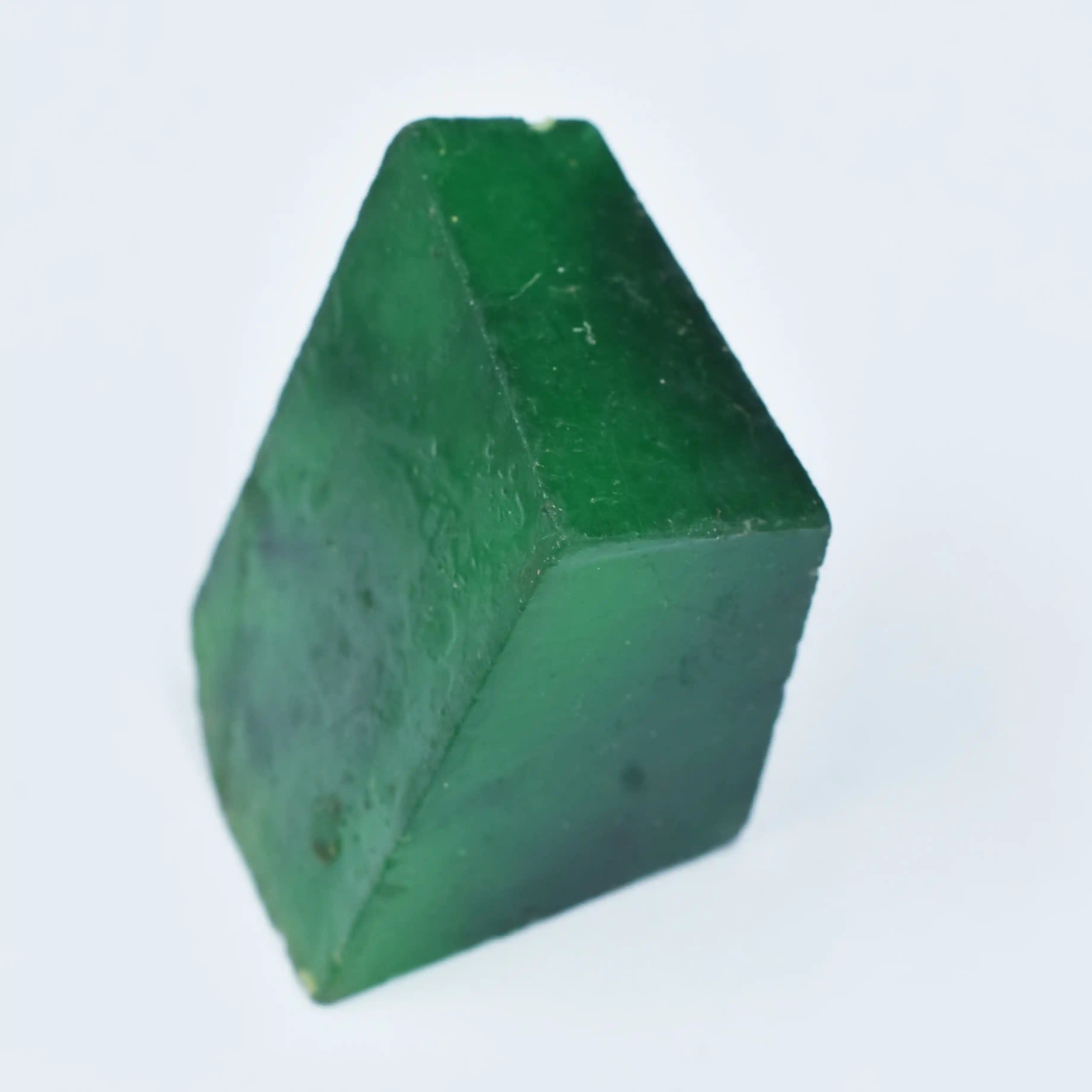 “Uncut green mineral stone showing organic patterns and rough surface.”