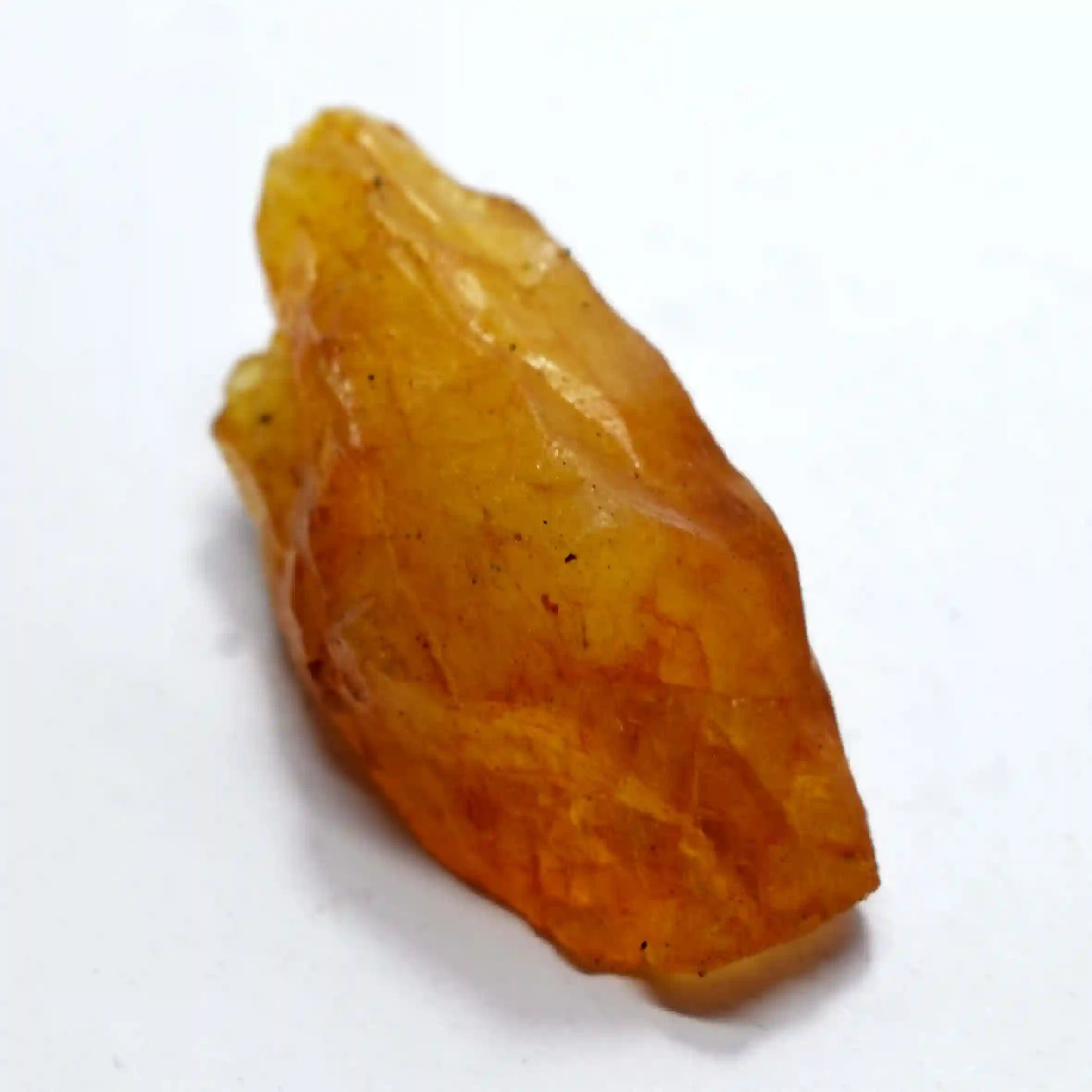 Yellow crystal on a white background