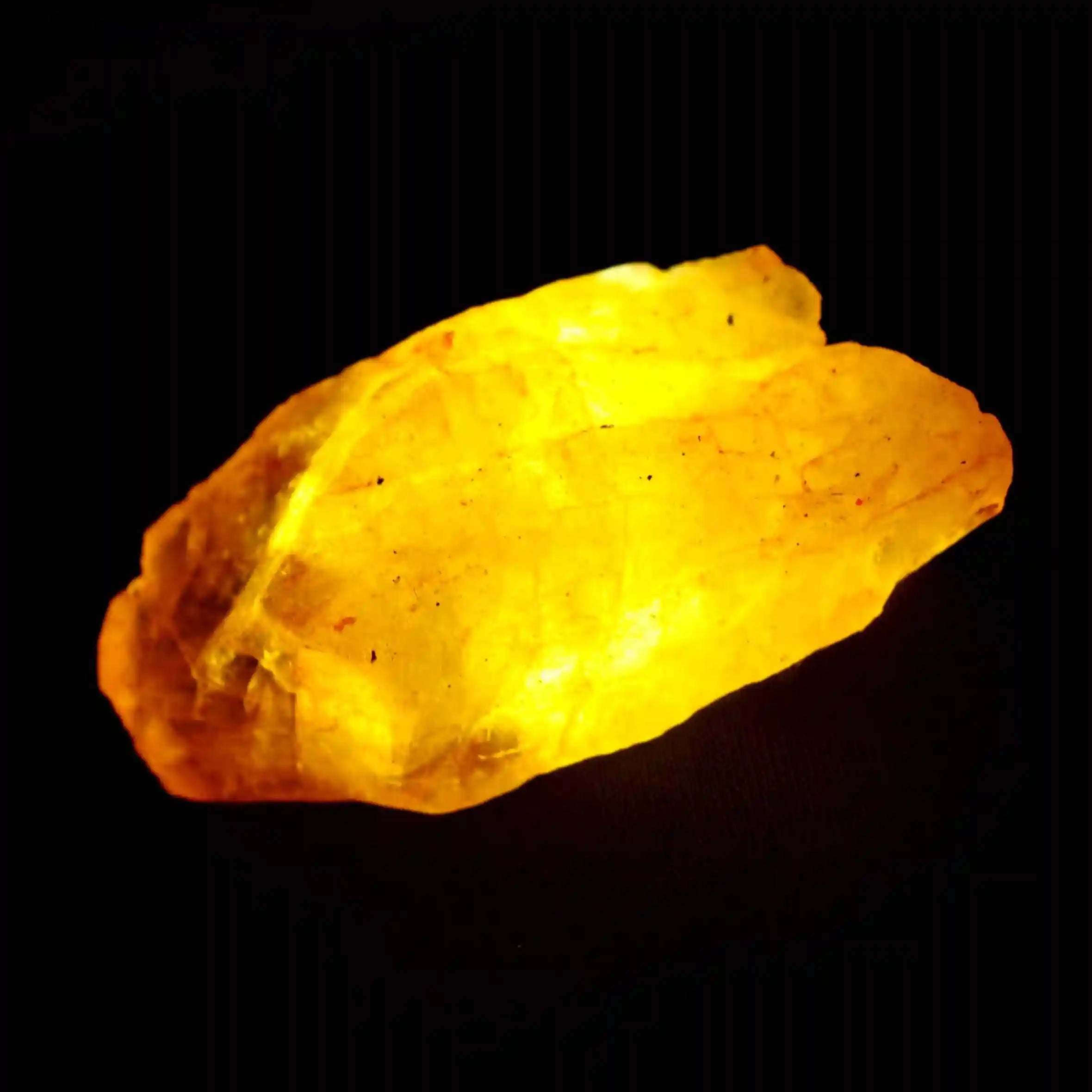 Yellow crystal on a black background