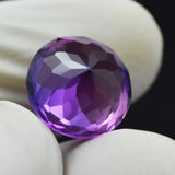 Certified round-cut sapphire, 10.23ct, with an awesome purple color-change effect