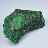 Green mineral rock on a light gray background