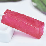 Pink gummy candy on a white surface